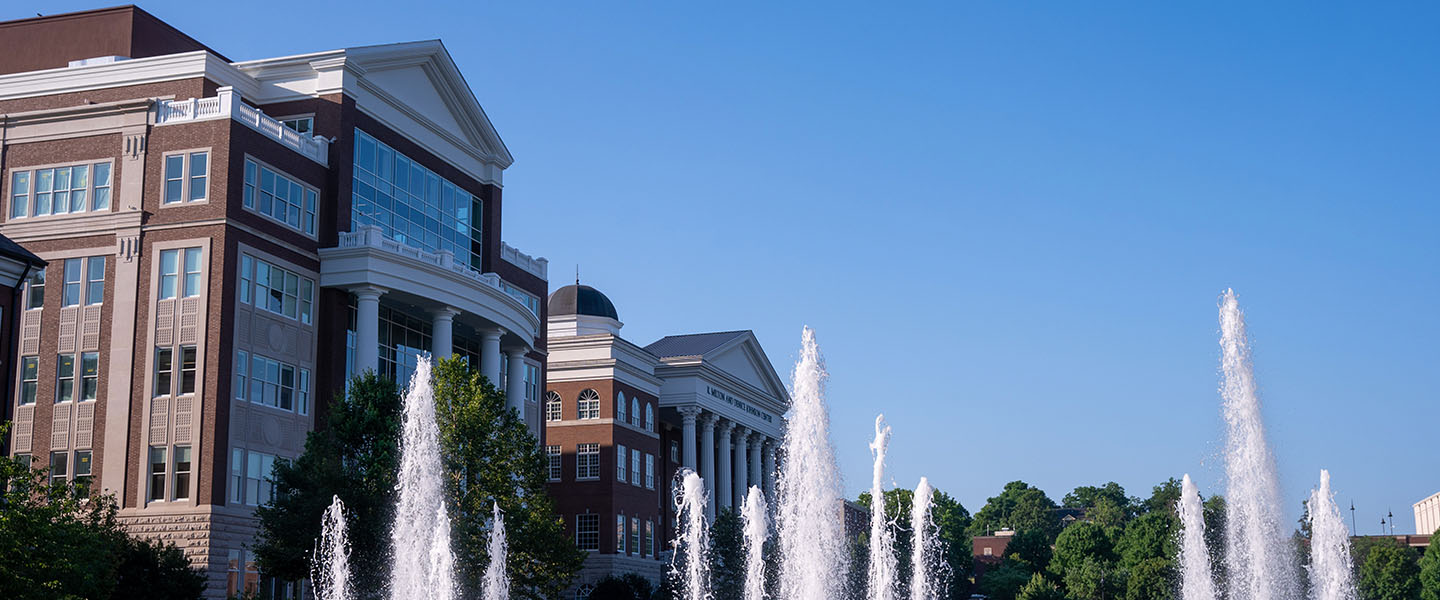 Image of campus buildings with water fountain in the front