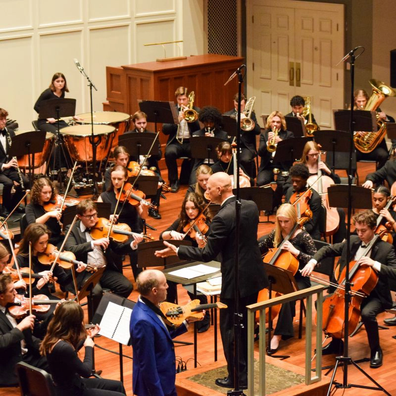 Dr. Christopher Fashun conducts the symphony orchestra