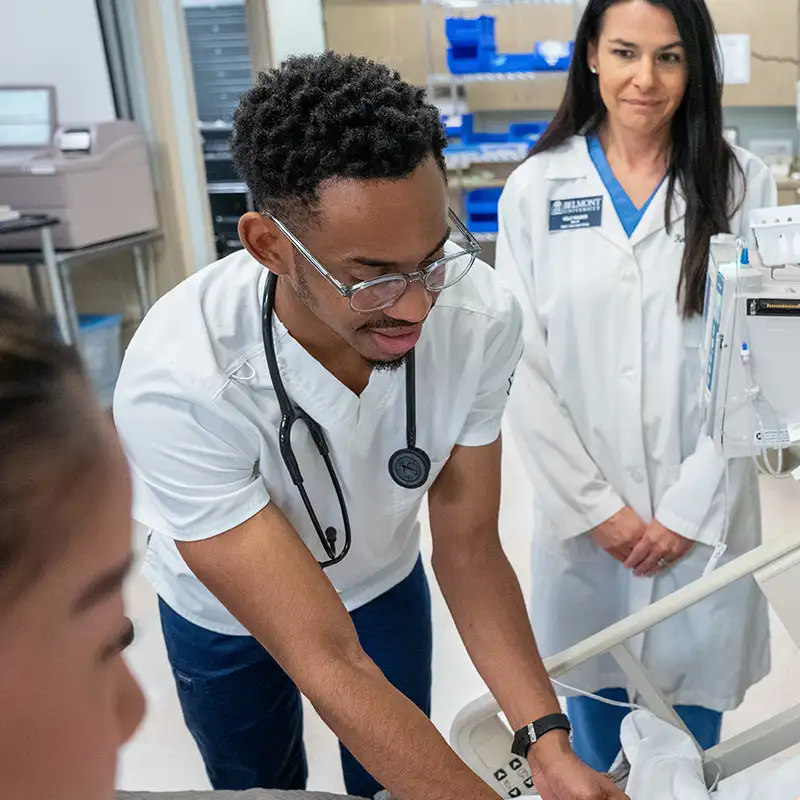 a male nursing student working in a nursing lab