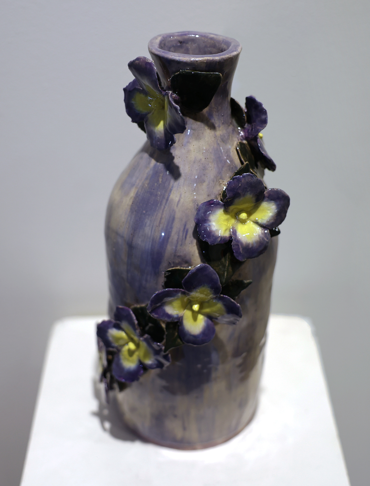 Student pottery work of a vase with flowers