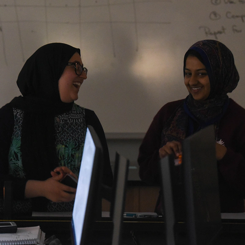 Students looking at computer