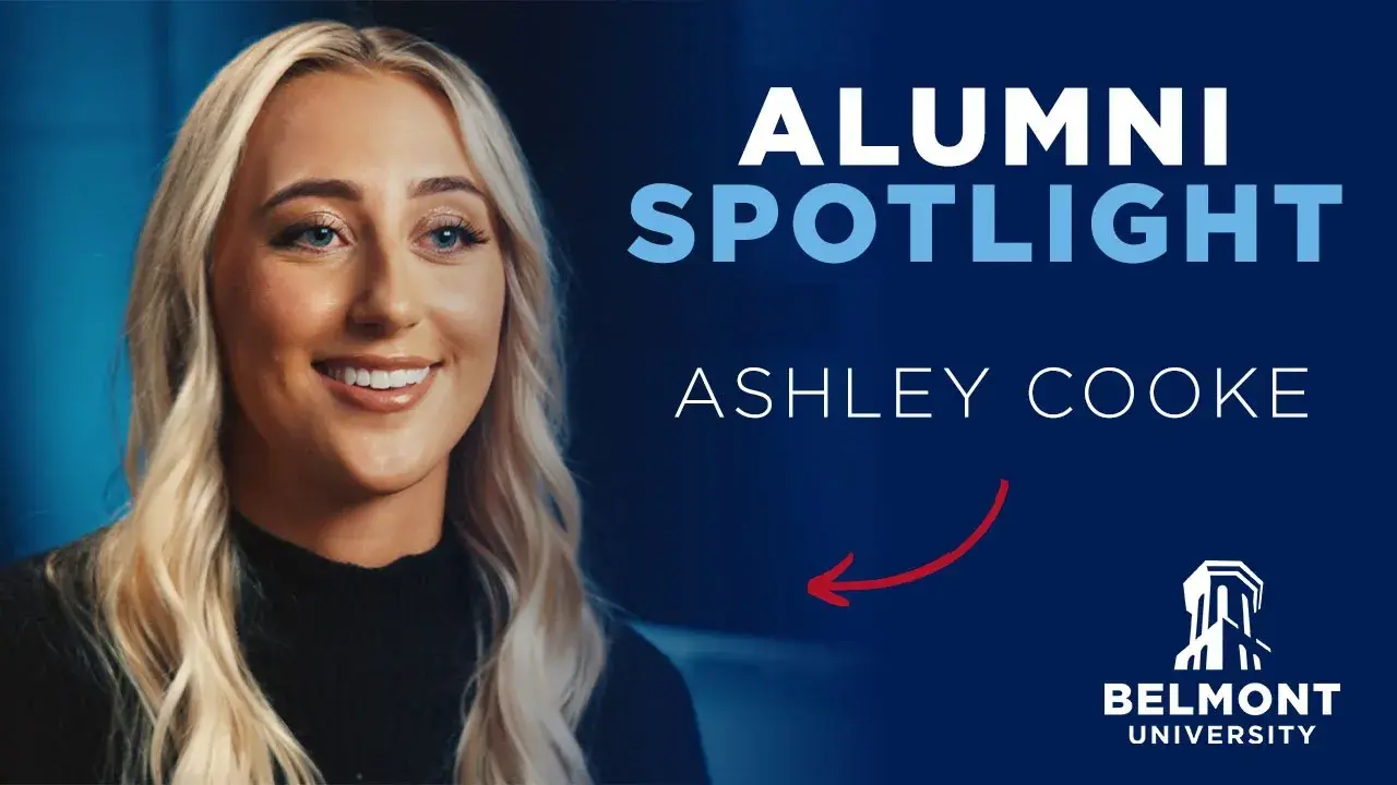 A promotional graphic featuring Ashley Cooke, a Belmont University alumna, smiling with long blonde hair and wearing a black top. The background is dark blue, with the words "ALUMNI SPOTLIGHT" in bold white and blue text. Below, her name "ASHLEY COOKE" is displayed in white, with a red arrow pointing to it. The Belmont University logo, featuring the Bell Tower, is in the lower right corner.