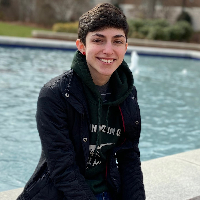 Sam Giamundo smiles with the Freedom Plaza Fountain behind him