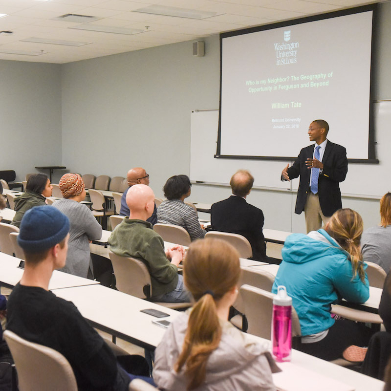 Students listen to professor during class lecture