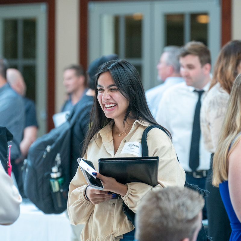 A student smiling at a job fair