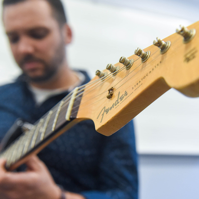 A close-up image of the strings on a guitar.