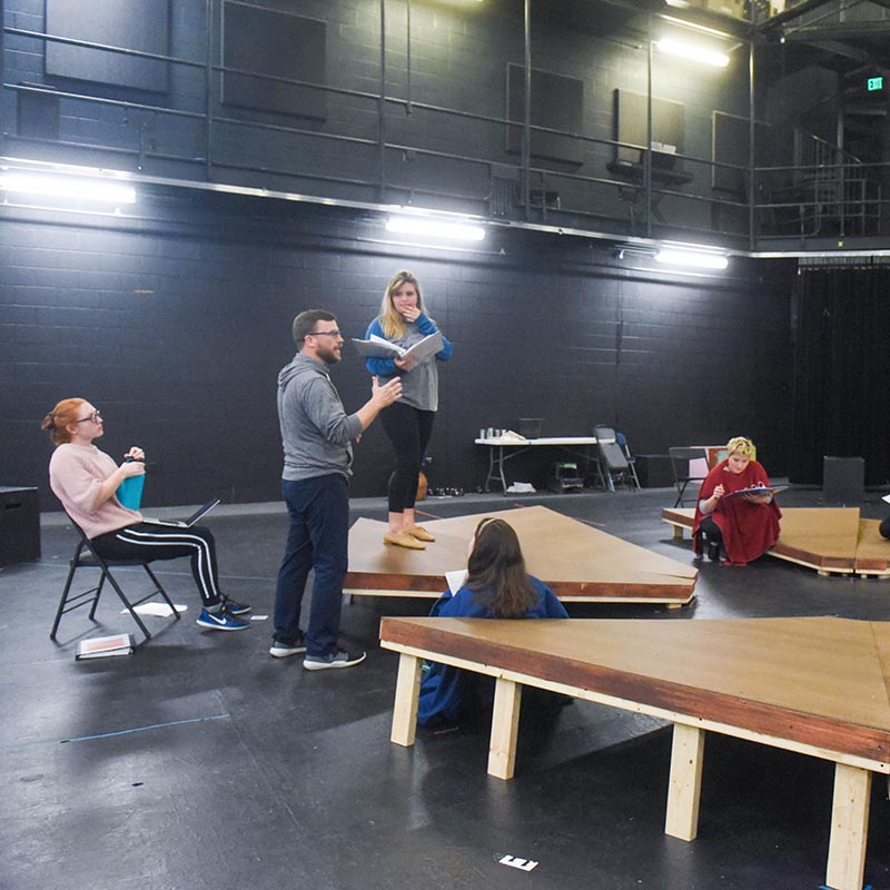 Theatre students rehearsing a theatre production backstage