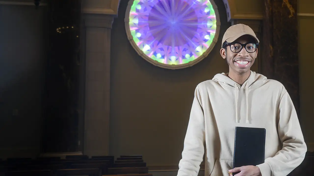 DJ Carr standing in Belmont's Chapel