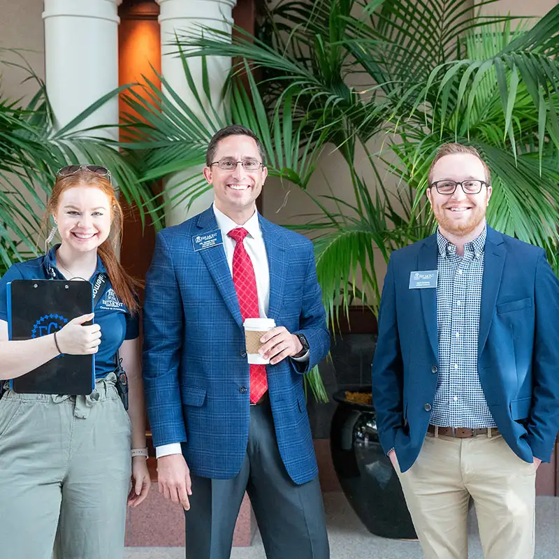 Two Admissions counselors with a student at Preview Day