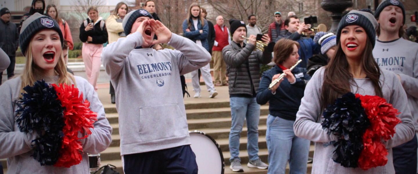 Belmont cheerleaders cheer outside on campus during Homecoming Parade.