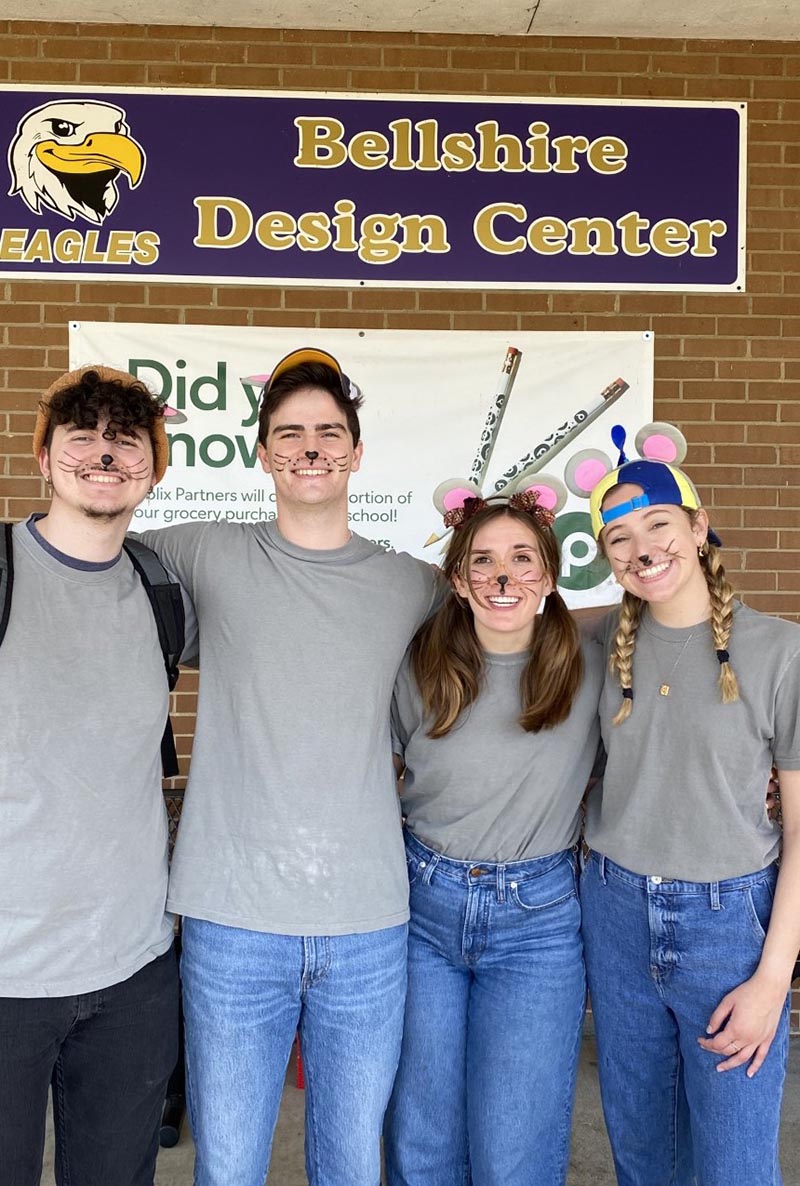 Student in mouse face paint and mouse ears pose for picture for Belmont Repertory Company