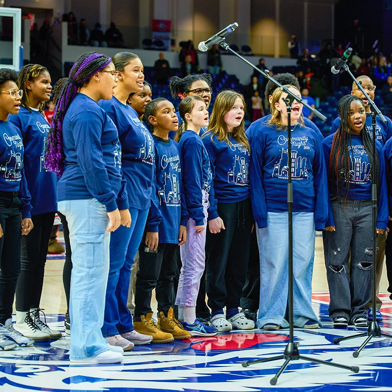 Children singing in a mike in the Belmont Curb Center