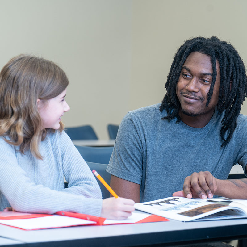 An Education student working with a child