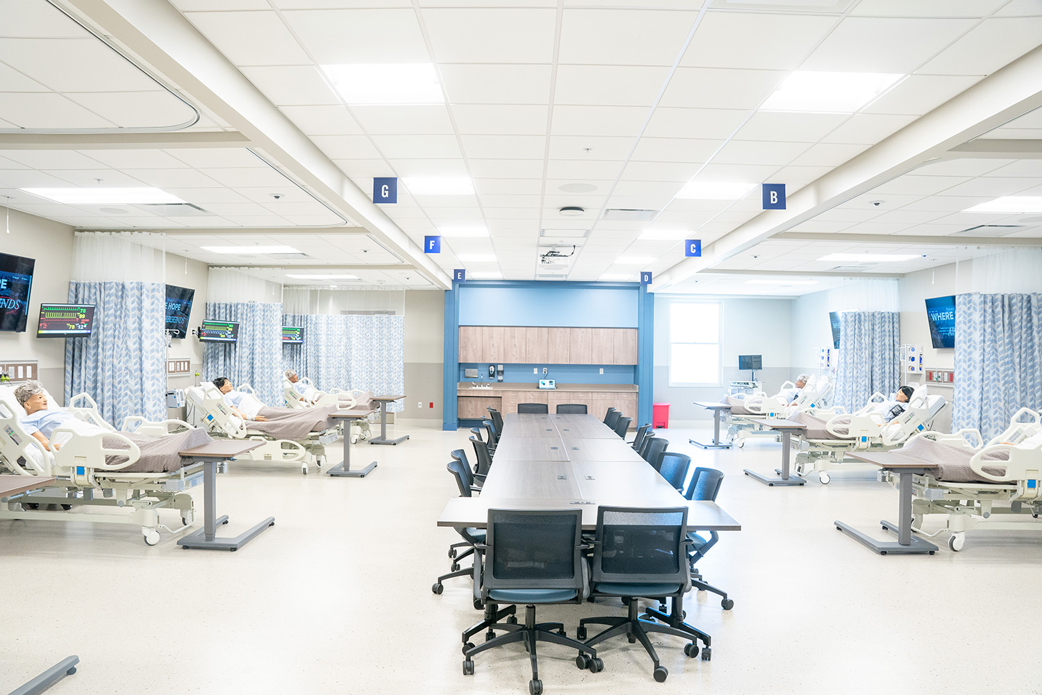 Empty hospital simulation lad with multiple hospital beds and medical dummies