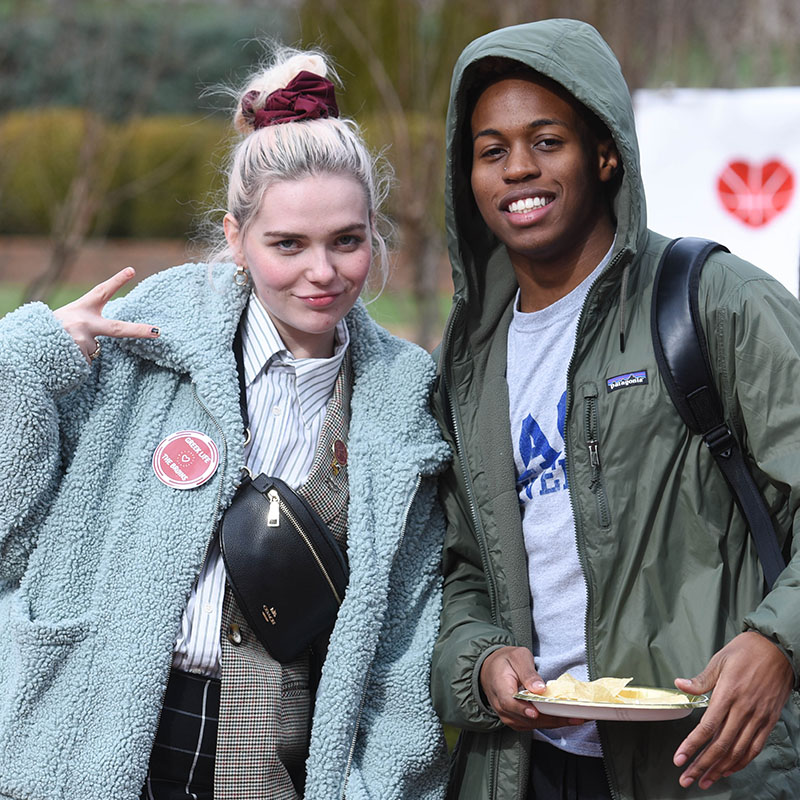 Two Greek Life students during the homecoming tailgate