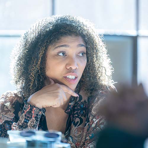 Woman networks while sitting a table during a seminar