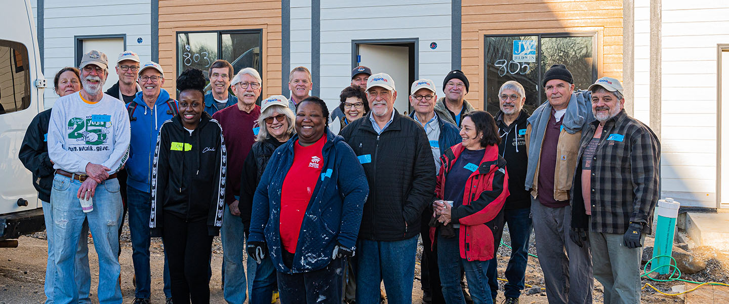 a group of people posing at a community event