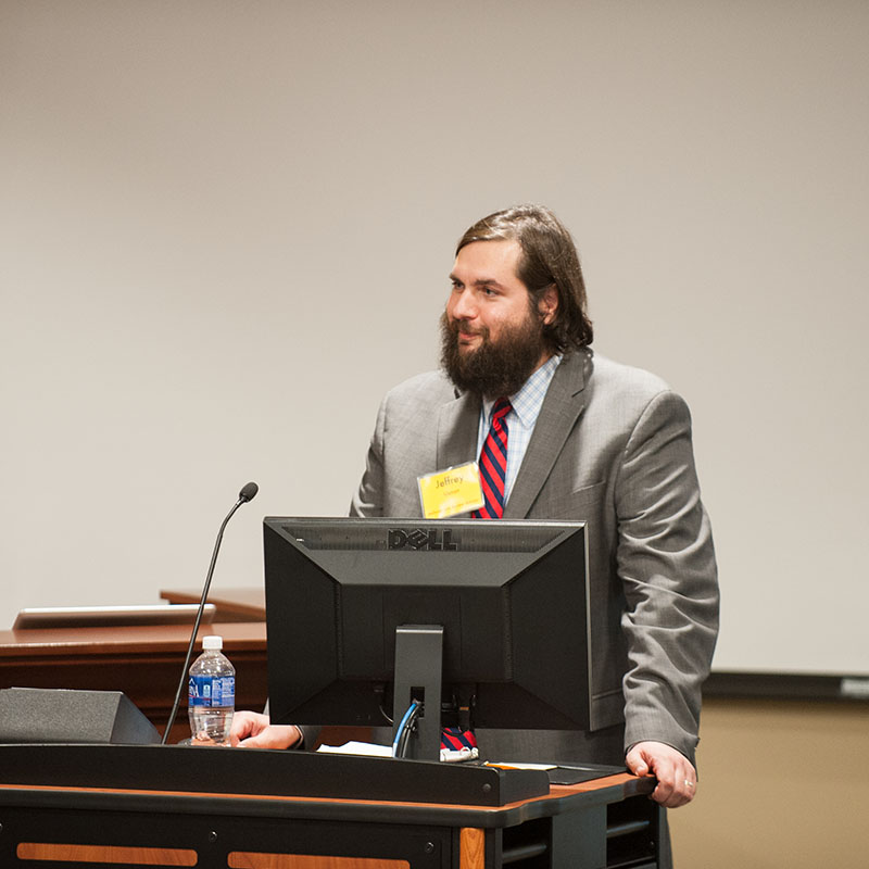 Professor talks at a podium