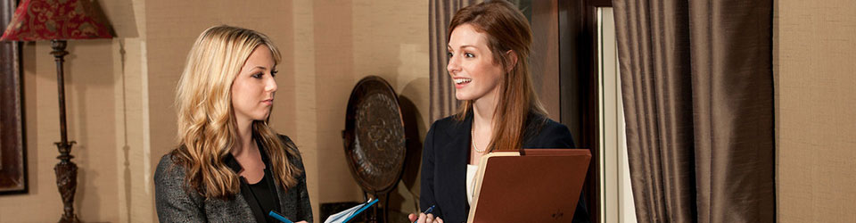 two students standing and talking