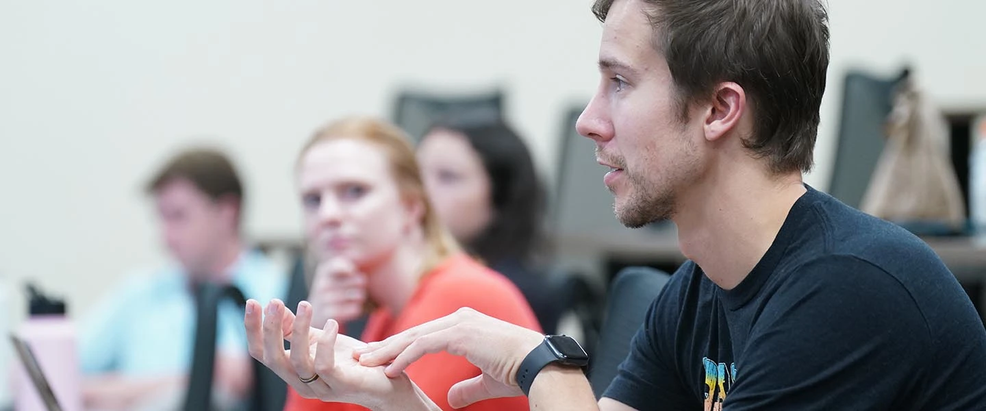 students talking during class room discussion