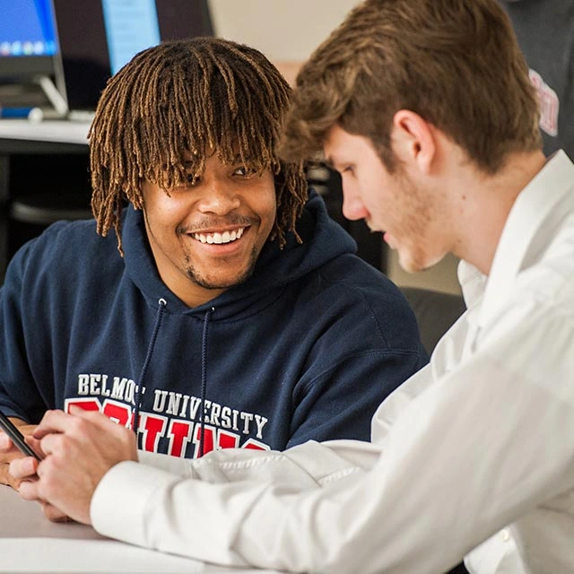 students talking to each other during class room discussion