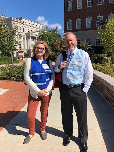 Building Coordinators smiling together outside on a sunny day