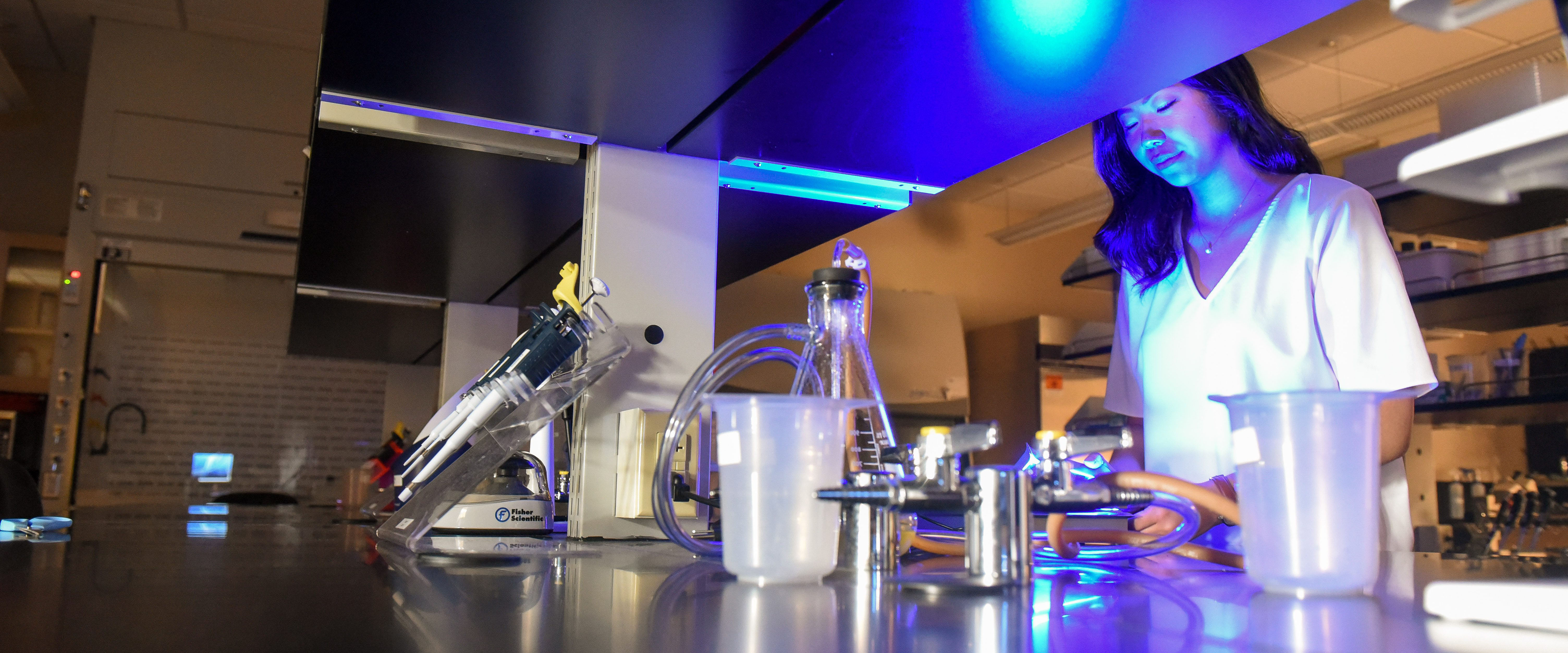 Student working at table in science lab