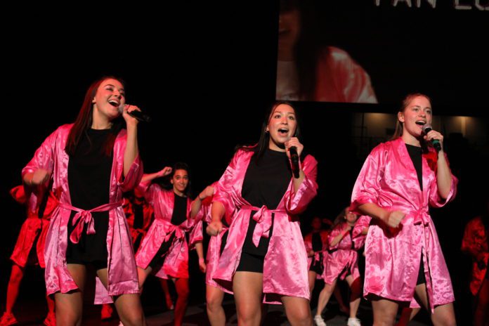 Students sing during Greek Sing