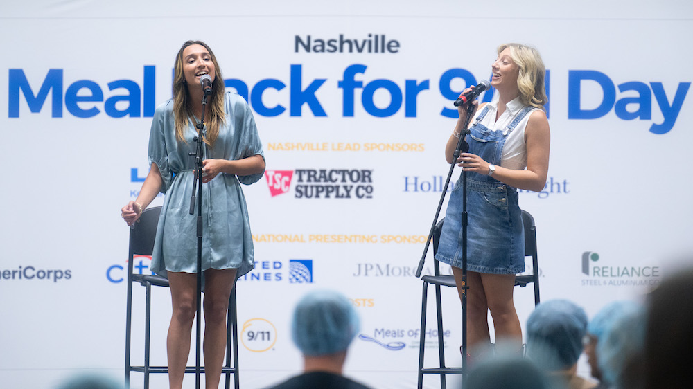 students singing the national anthem