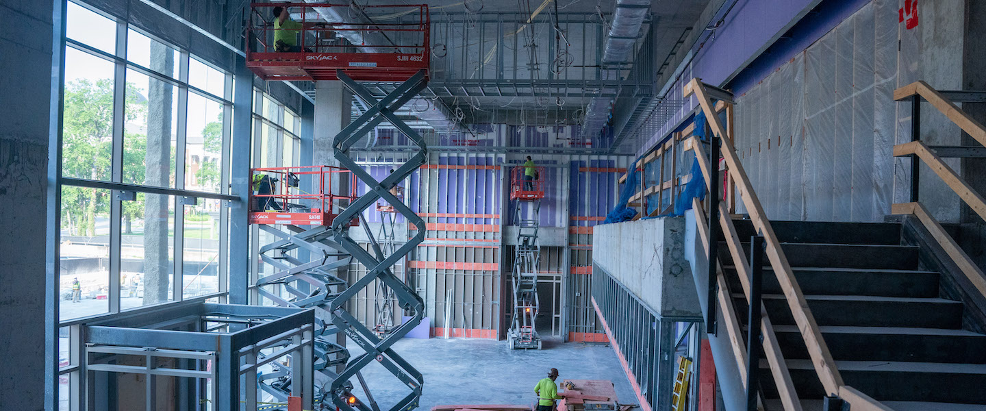 Image of building construction with workers.