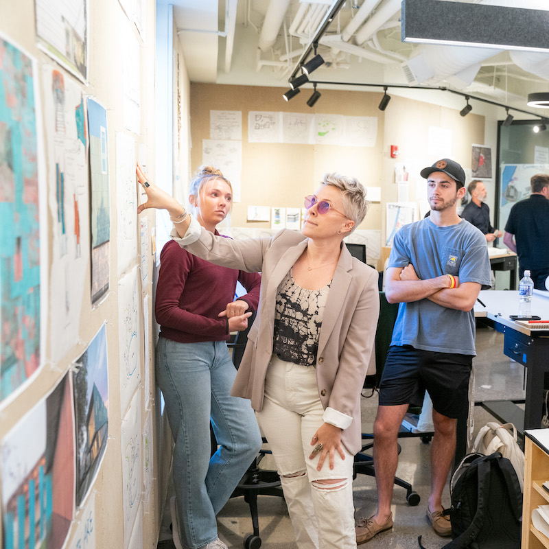 Student Kim Page Sullivan presents her team's project in a workshop with local design professionals