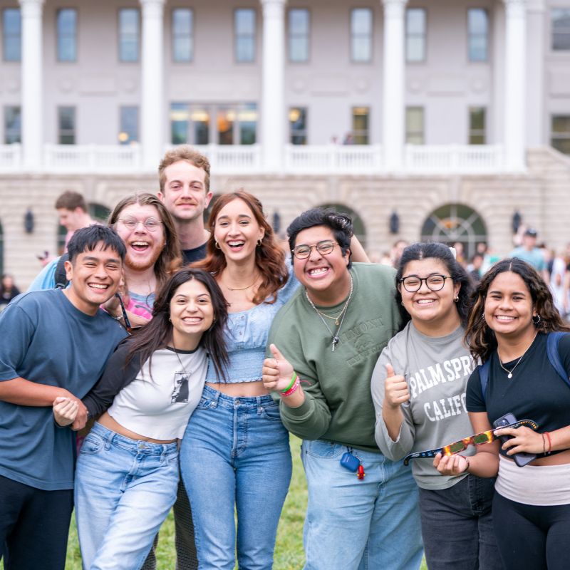 Group of students gathered and smiling at the camera