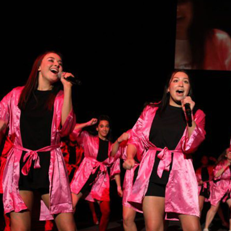 Students sing during Greek Sing Event