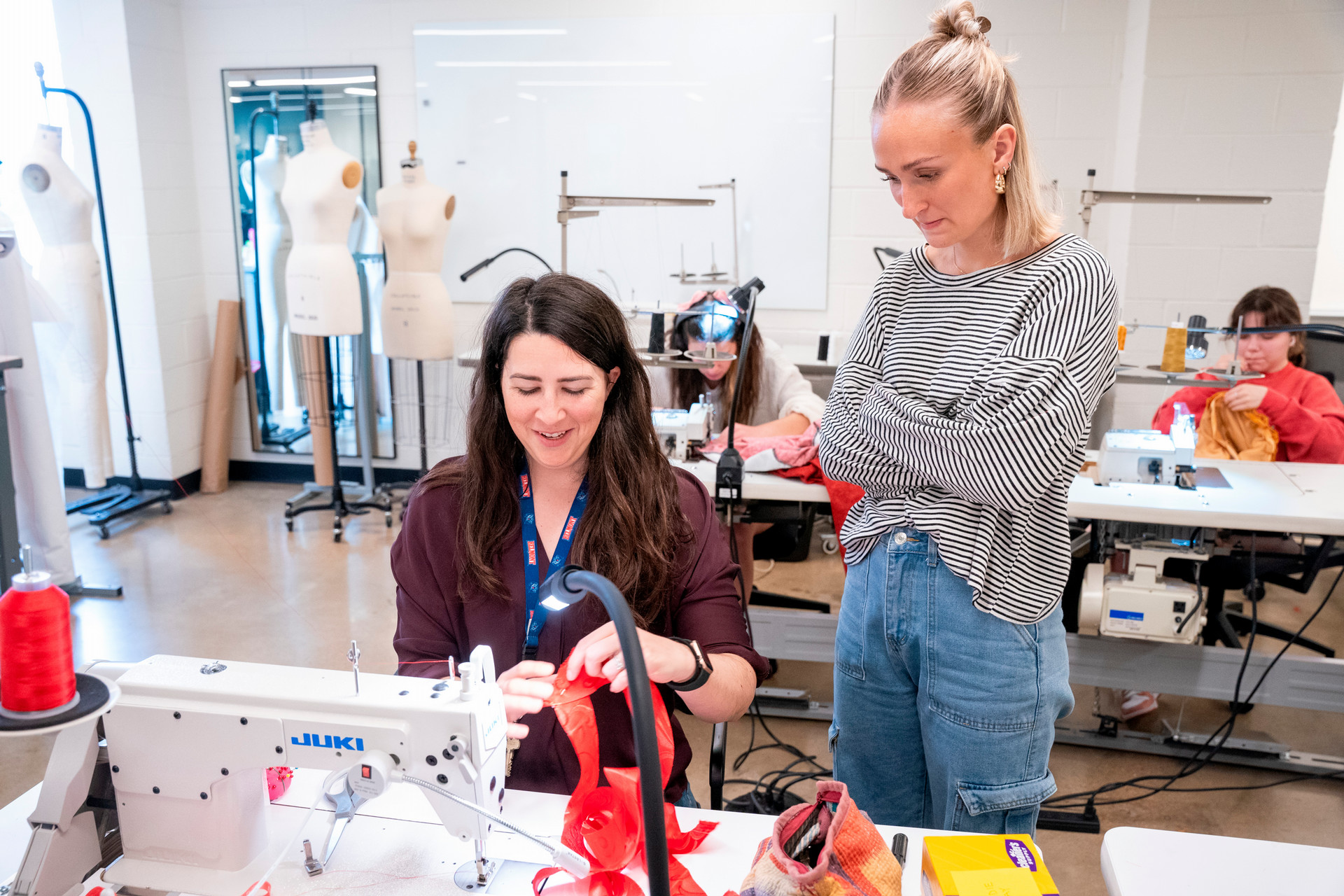 Fashion professor helping student