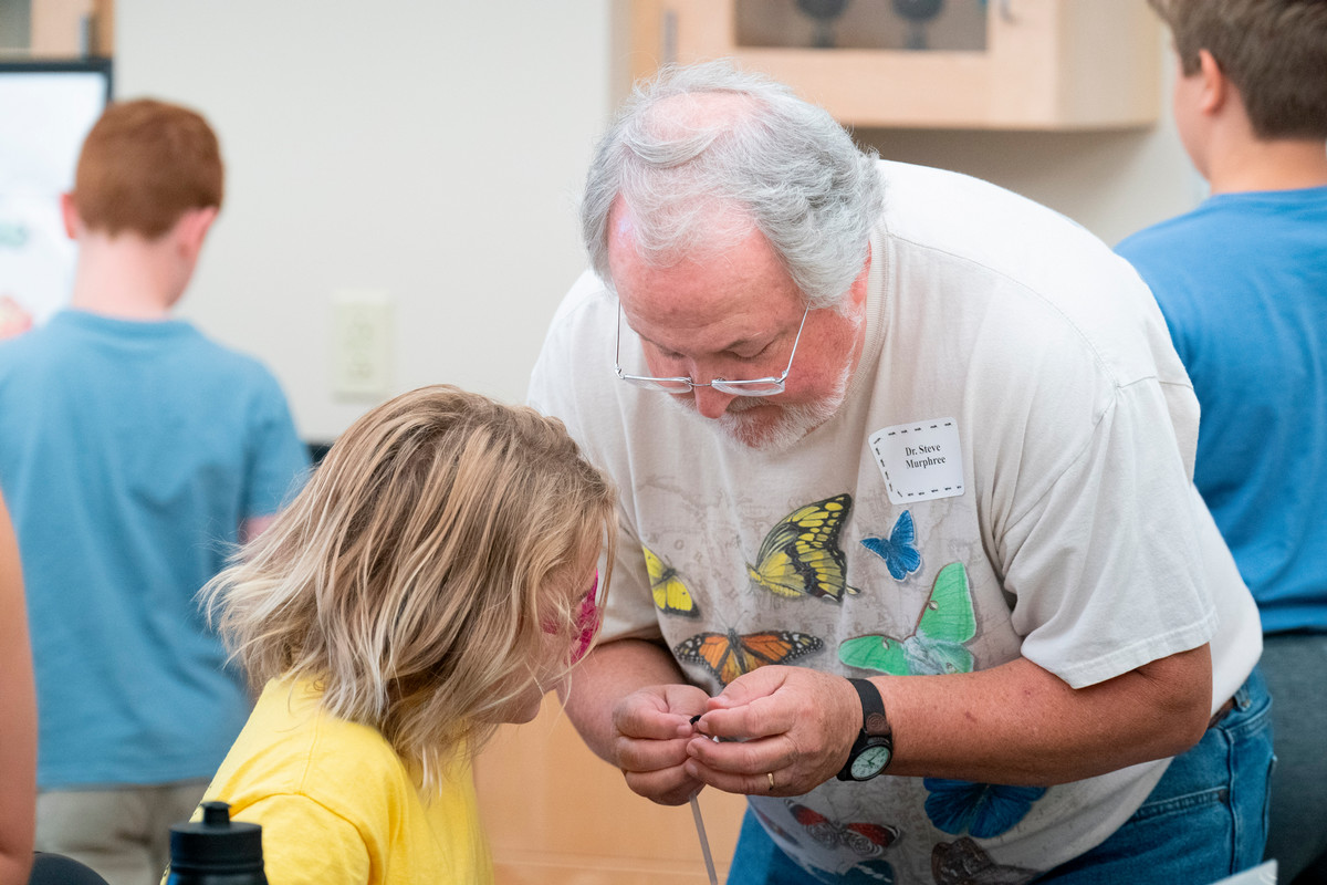 Dr. Murphree helps a camper