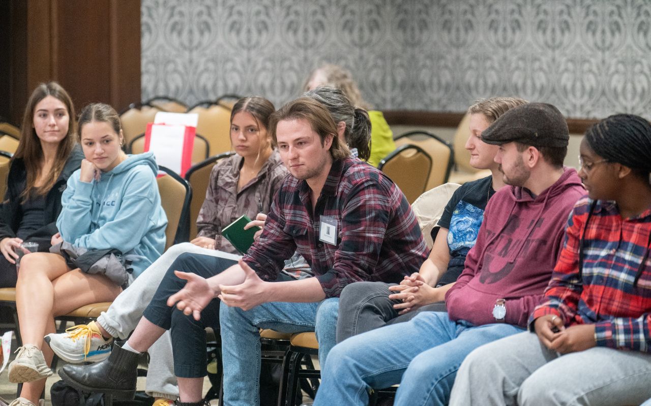 Students discuss in a circle