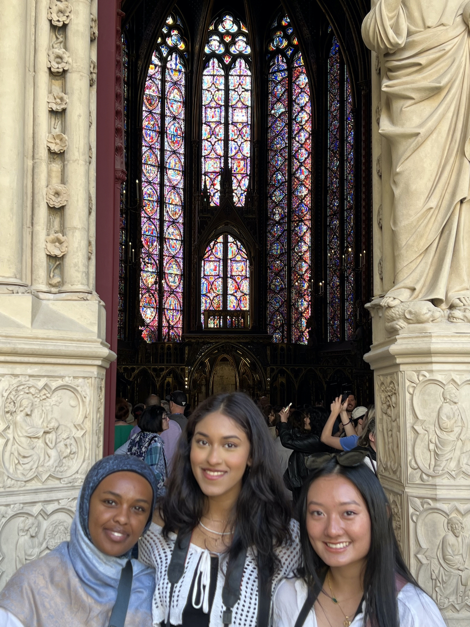 Students standing in front of a European church