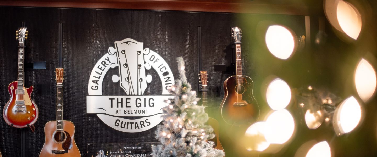 Songs for the Holidays set with guitars on the walls and Christmas trees