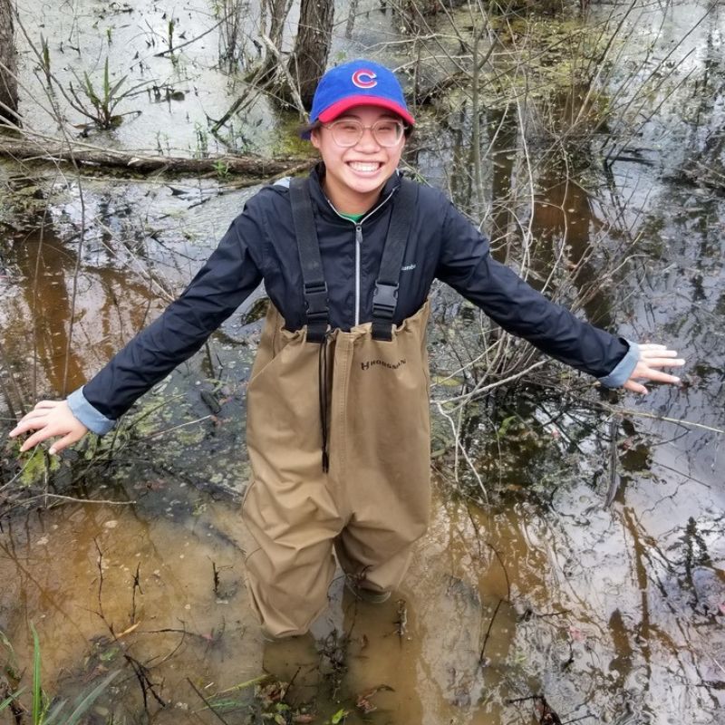 A student collecting samples along the Cumberland River