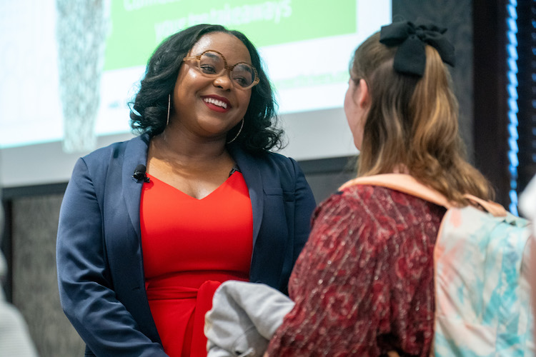 Brittany Cole speaking to student