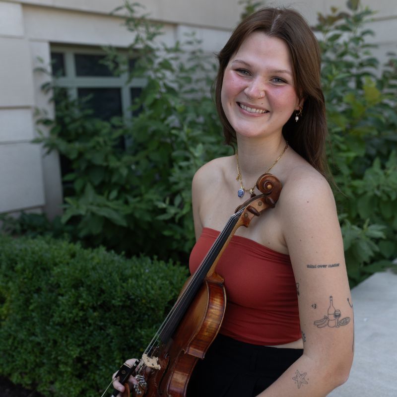 Kara Schlenk poses with a violin