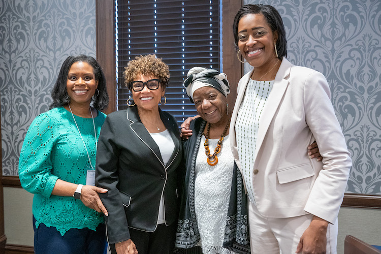 Dr. Candice Lee taking group picture with Belmont staff