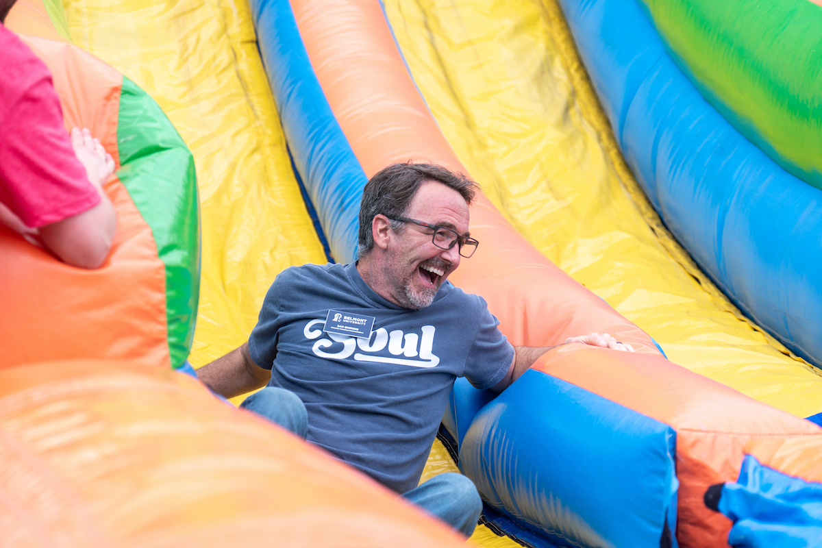 Man on inflatable slide