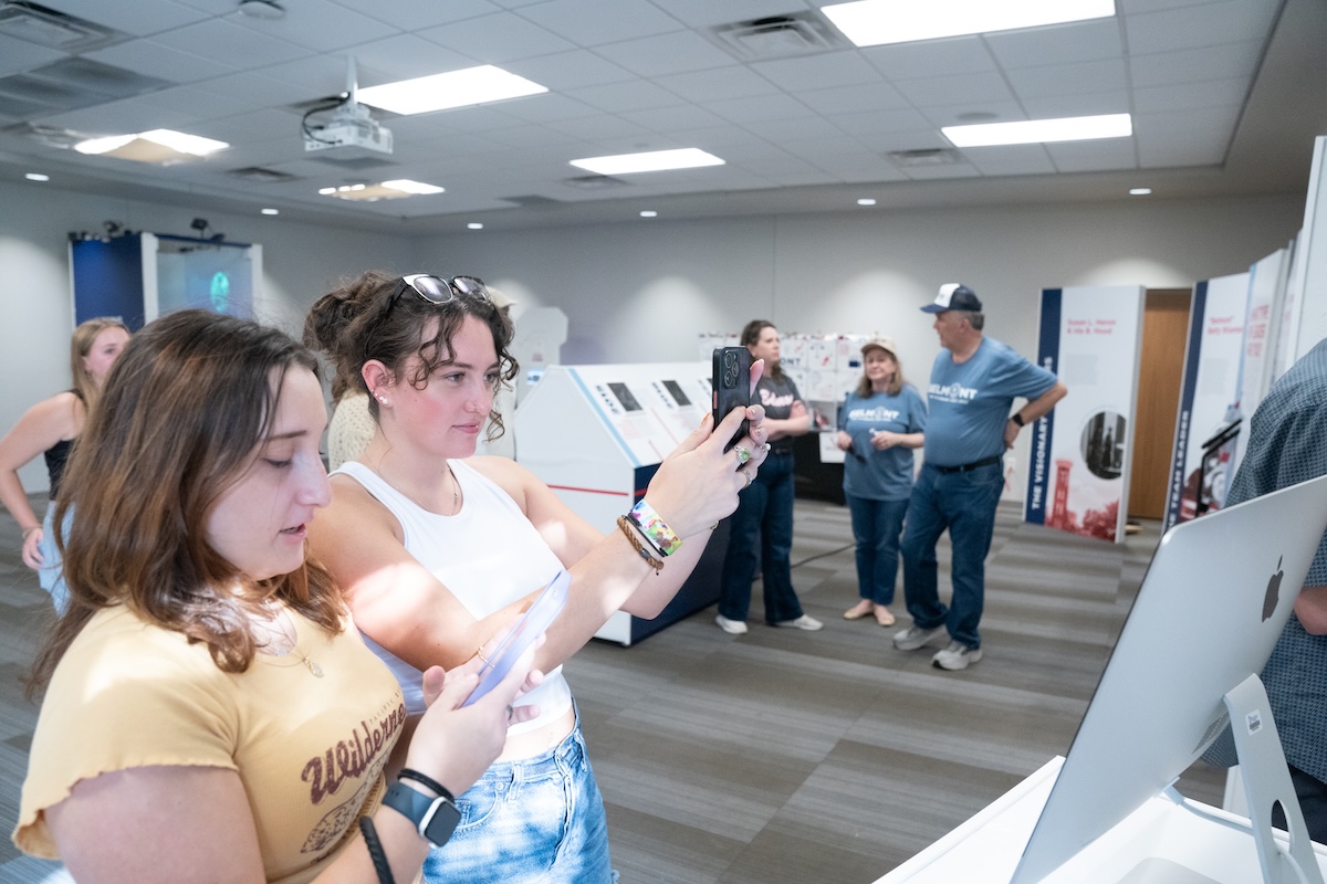 students interact with part of the exhibit