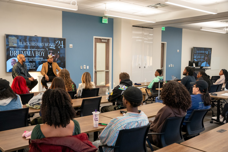 Drumma Boy in front of classroom full of Belmont students