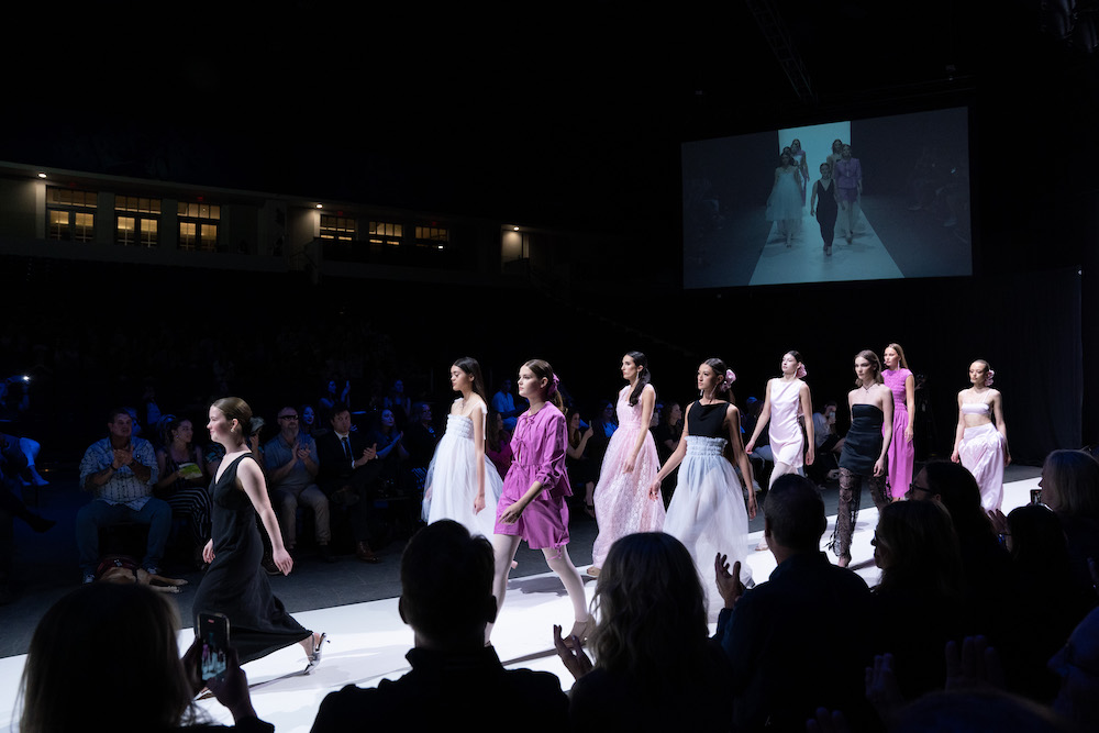 Fashion design student and the models showcasing her designs walk down the runway at the 2024 fashion show