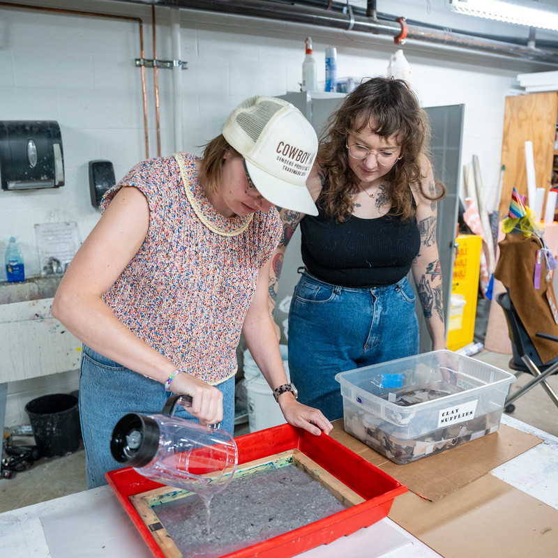 two students work in the studio