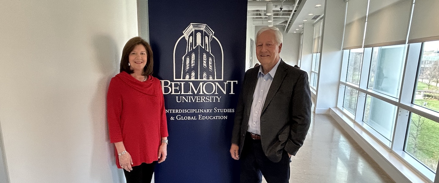 Kim Powell and Dr. Bob Fisher pose outside of ISGE office