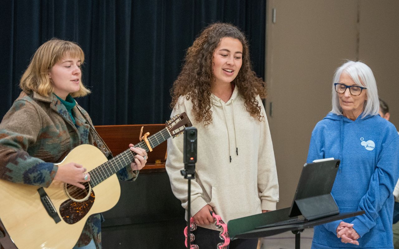 Songwriters perform a song together during The Friendship Project