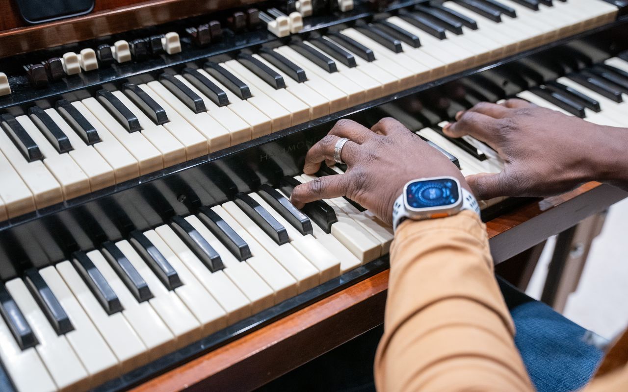 tight shot of a man's fingers playing the piano